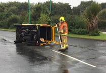 Van overturns near airport