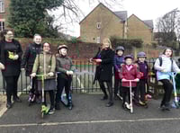 Children ride scooters to breakfast club