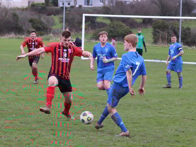 Malew’s Eddie Cooper and DHSOB’s Ty Thompson in action during Saturday’s ECAP FA Cup tie