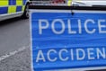 Motorcyclist's legs trapped under another vehicle