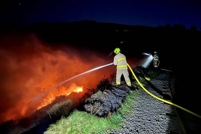 Firefighters tackling the blaze in Groudle