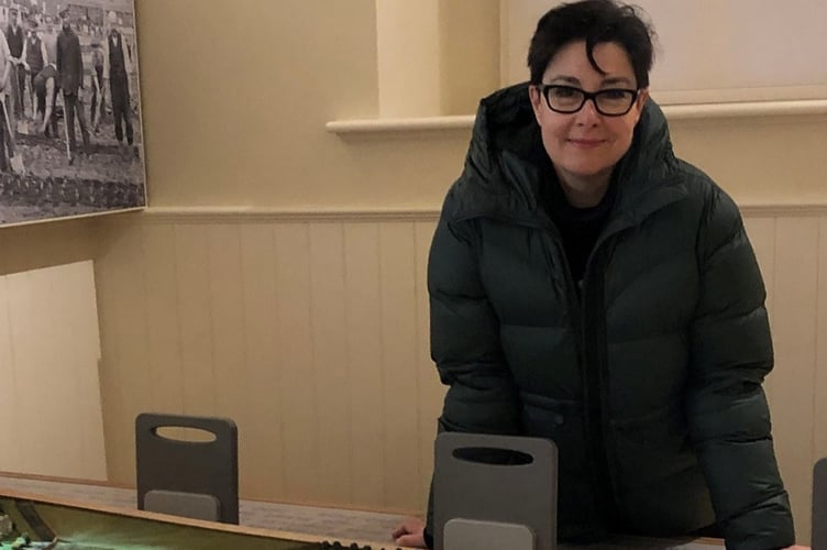 Sue Perkins with the layout model of the camp at Knockaloe       