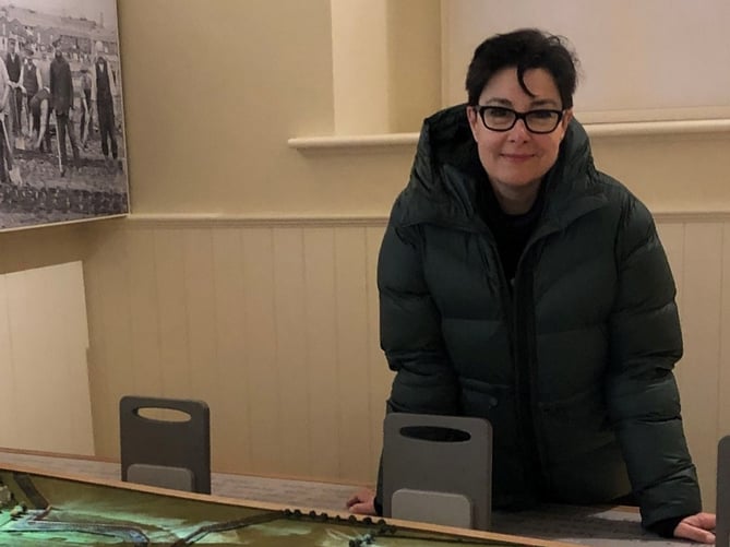 Sue Perkins with the layout model of the camp at Knockaloe       