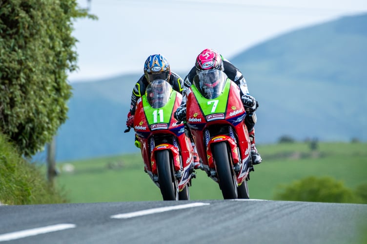 Gary Johnson leads his Dafabet Racing team-mate Rob Hodson during practice