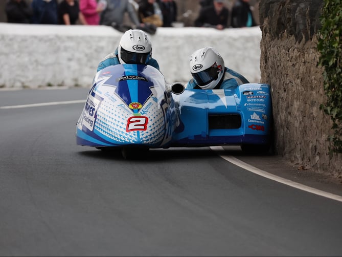 John Holden and Dan Sayle get close to the wall at Church Bends during Monday evening’s Southern 100 practice 