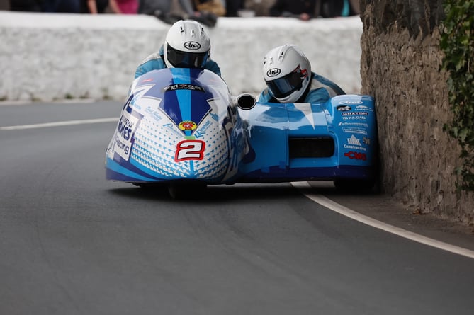 John Holden and Dan Sayle get close to the wall at Church Bends during Monday evening’s Southern 100 practice 