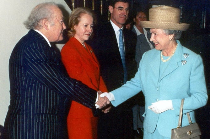 The late Sir Ray Tindle, owner of this newspaper, is pictured here meeting the Queen. He knew many members of the royal family and was particularly close to Charles.