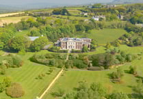 This mock-Georgian mansion comes with its own tennis court and library