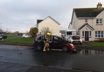Firefighters deal with car blaze