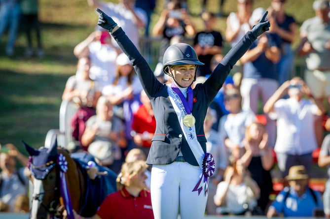 Yaz celebrates on the podium with her world championship gold medal