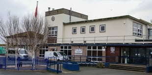 Treasury Minister committed to school plan despite its absence in book