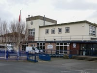 Treasury Minister committed to school plan despite its absence in book