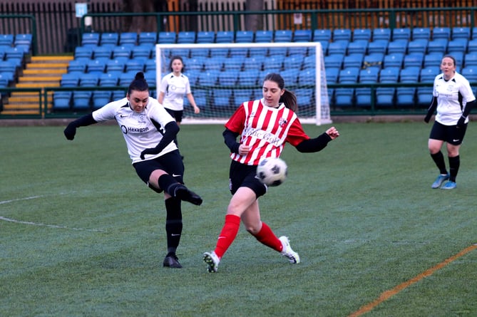 Corinthians' Kiera Morgan (left) in action against Peel during  the Women's Floodlit Cup group match at the Bowl. The Whites won 5-1