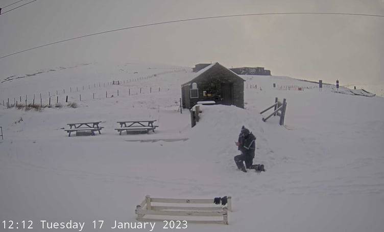 Man in snow on Snaefell mountain