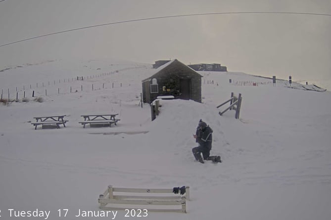 Man in snow on Snaefell mountain