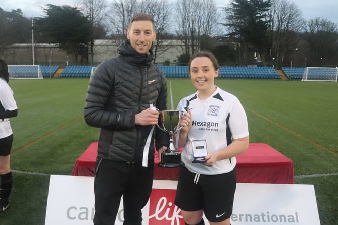Corinthians captain Anna Shaw received the Floodlit Cup from Canada Life's (sponsor) Dan Pownall