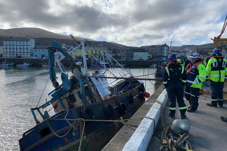 Emergency services were required to help refloat a boat in Ramsey Harbour