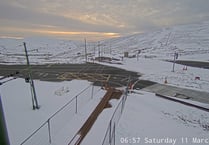 Rain this afternoon, snow on hills