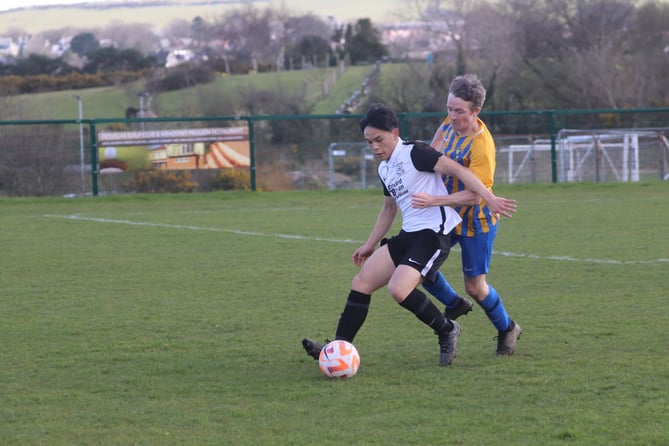 Corinthians' Ashton Canson (left) and St John's Utd's Harry Rothwell (right