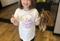 Seven-year-old Daisy gets her hair cut for charity