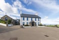 Farmhouse for sale comes with 22 acres and its own bar