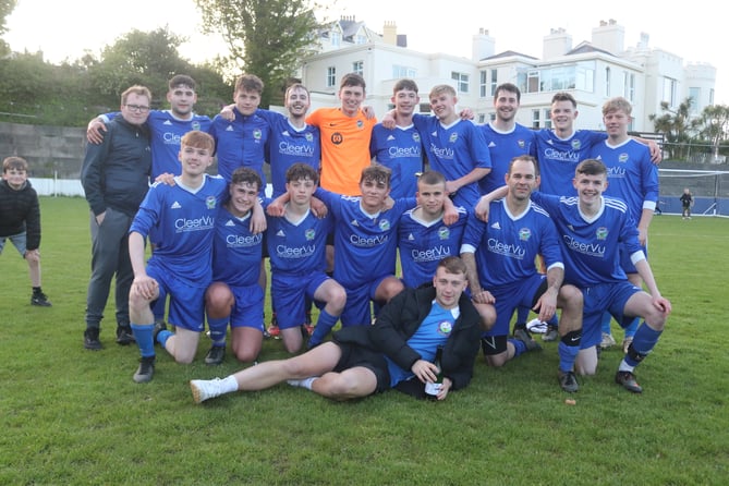 Braddan AFC players celebrate after beating RYCOB to seal promotion to the Premier League