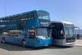 Electric buses carrying passengers during TT