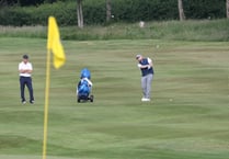 Defending champions remain on course