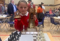 Rosa, 9, wins top chess trophy