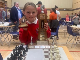 Rosa, 9, wins top chess trophy