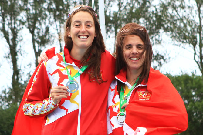 Rachael Franklin (left) and Rebekah Pate with their half-marathon team gold medals