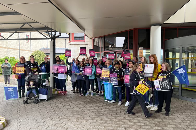 Royal College of Nursing members met outside Noble's Hospital this morning before marching to Villiers Square