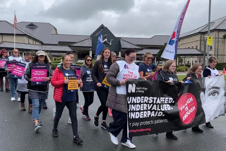 The nurses setting off this morning from Noble's Hospital with a banner and flags. (Tuesday July 18).