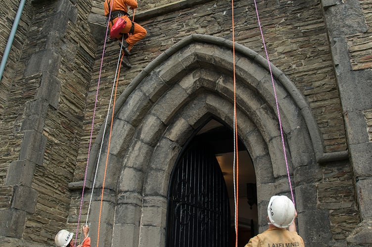 Nine members of Laxey Mines Research Group installed the new flower tower at St Thomas’ Church in Douglas