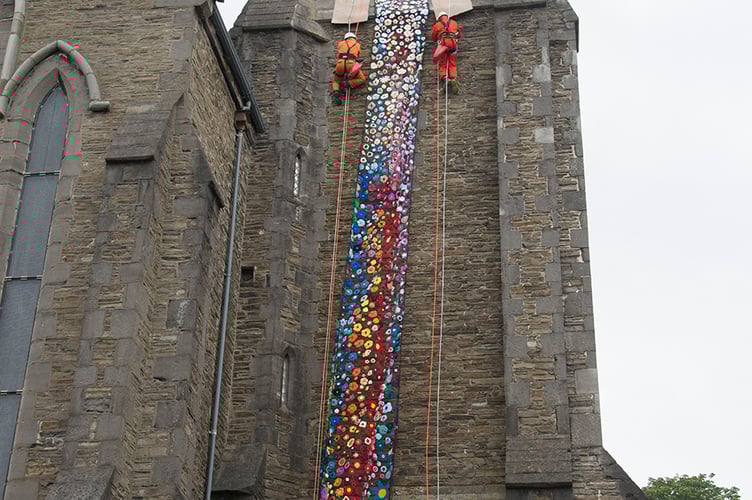 Nine members of Laxey Mines Research Group installed the new flower tower at St Thomas’ Church in Douglas