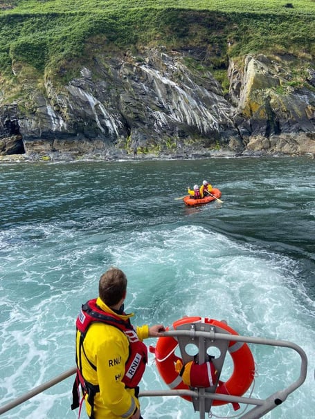 The lifeboat crew rescue an individual cut off by the tide