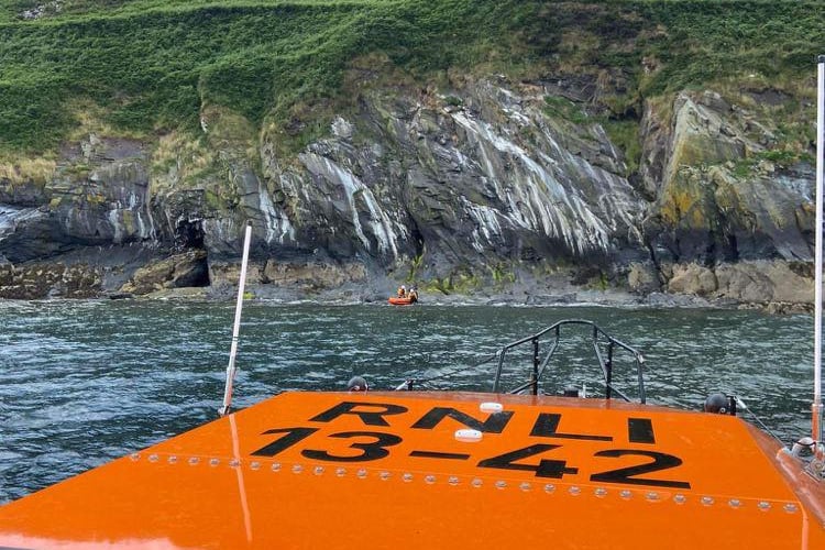 The lifeboat crew rescue an individual cut off by the tide