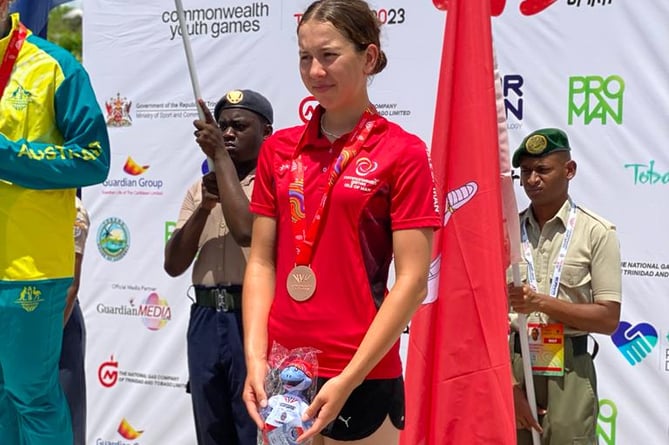 Ruby Oakes on the podium with her bronze medal