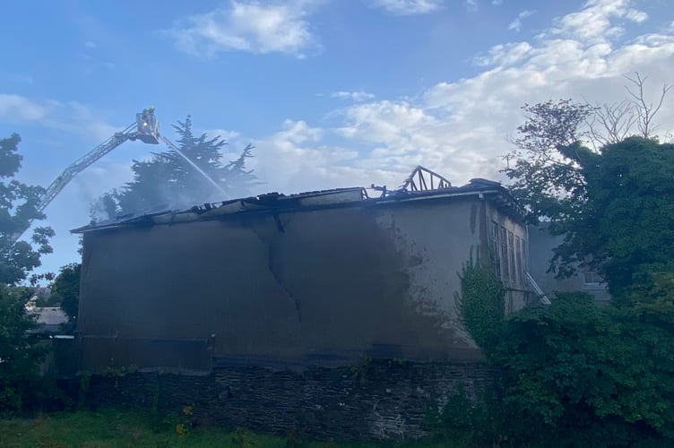 Fire crews deal with the fire at what is believed to be Africa House on Woodbourne Road