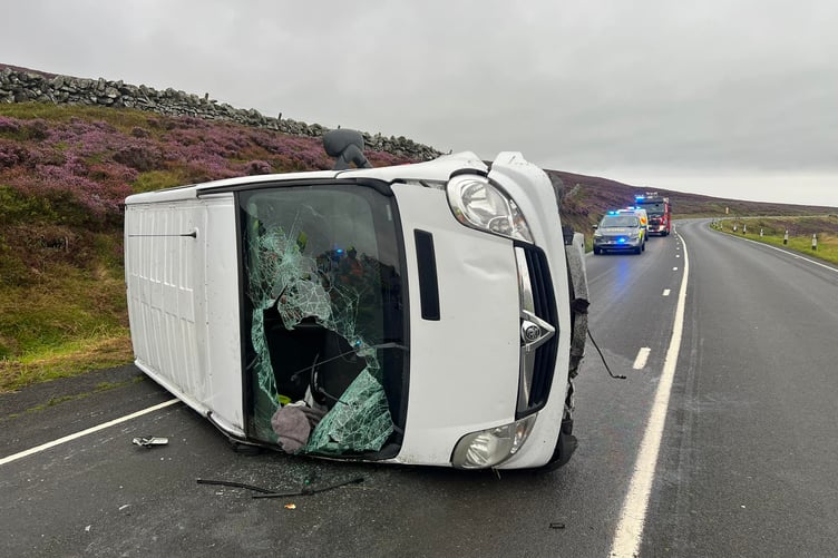 A car has overturned near Kate's Cottage