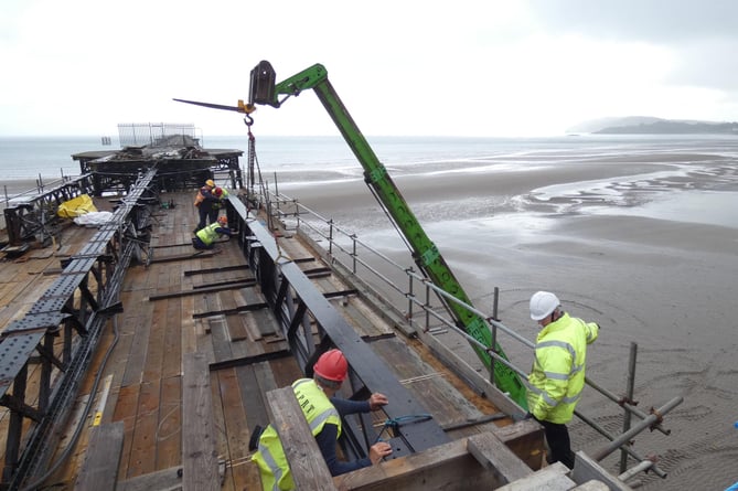 Replacement steel is lifted into position on bay 6