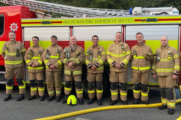 Sir John Lorimer joins in drill session at Laxey Fire Station