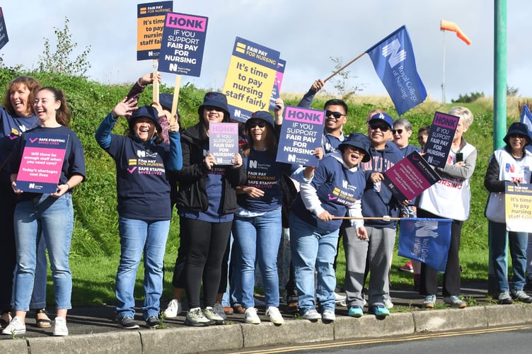 The nurses on the picket line today are encouraging cars to beep in support.