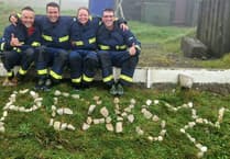 Island firefighters finish grueling six peaks challenge with epic 'fire kit' finale
