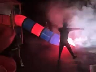 Second video shows teens shooting fireworks down slide at playground