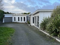 Bungalow seized over unpaid debts set to be sold at auction