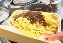 Watch as chippy serves up perfect portion of chips, cheese and gravy