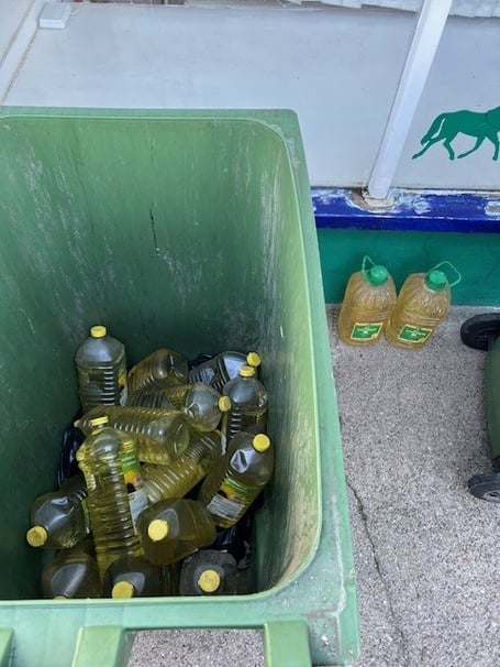 Used cooking oil in residential bins on Shore Road.