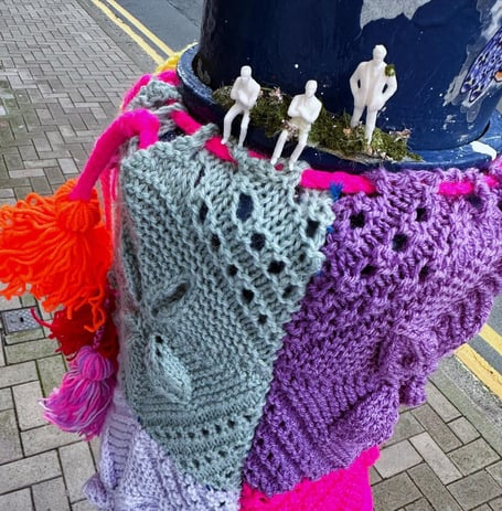 Ramsey Commissioner Lamara Craine has had her colorful woolen lamppost decoration removed