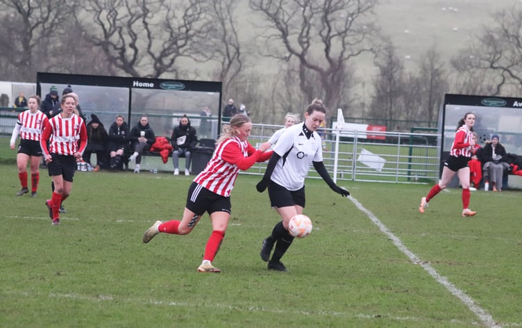 Corinthians' Ellen Gallacher (right) and Peel's Lisa Costain in action